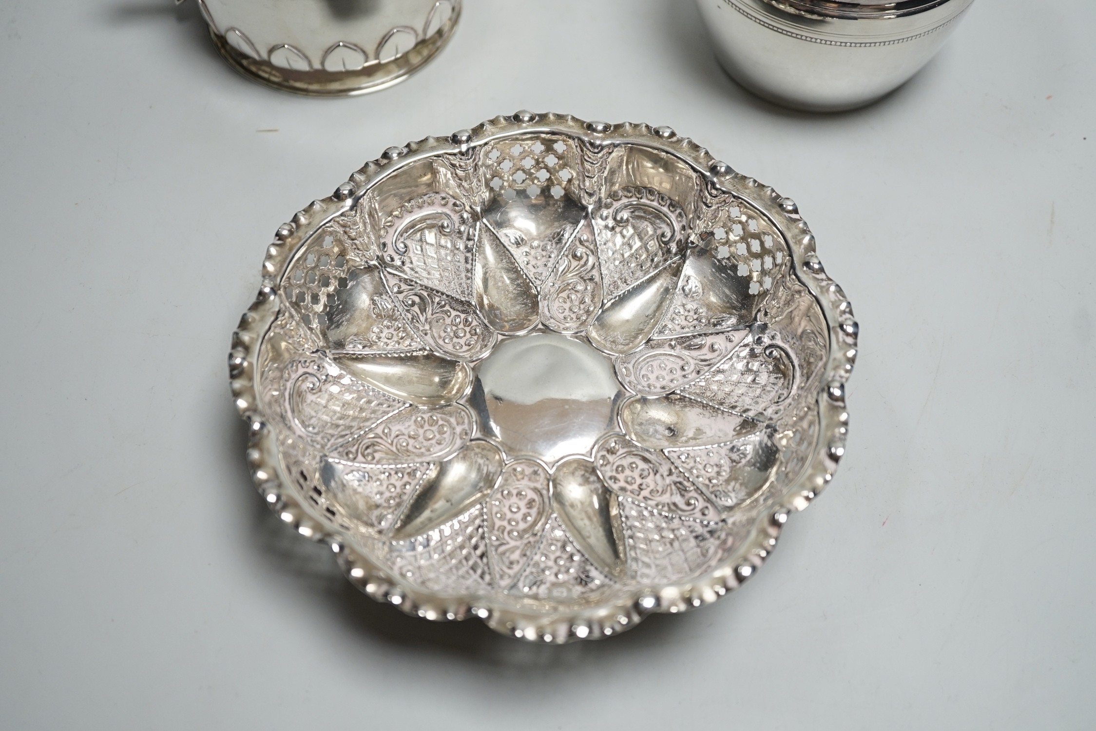 An Edwardian repousse silver shallow bowl, Birmingham, 1901, 16.1cm, together with a modern silver toilet jar and a 1920's silver two handled small bowl, 14.9oz.